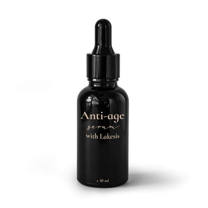 A black bottle with a dropper containing anti-aging serum labeled 'Anti-age serum with Lakesis'.